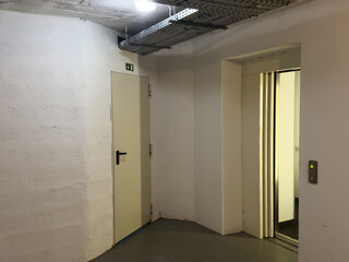 Fototapeta premium shabby walls and communications on walls, with tiled walls