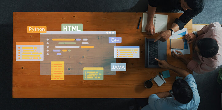 A group of professionals collaborates on a programming project, showcasing various coding languages like HTML, , , and C in a modern workspace. Trope