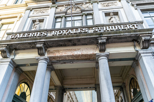 Street wall entrance in Brussels Royal Galleries of St. Hubert. Old architecture in Belgium facade. Brussels, Belgium - October 28, 2025
