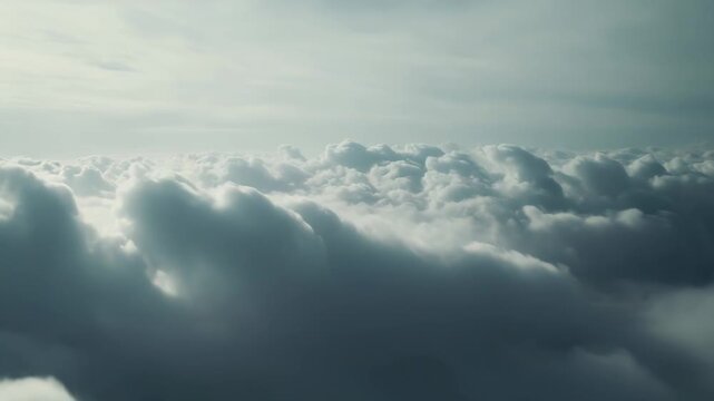 Clouds create a peaceful, abstract landscape from an aerial perspective, presenting an inspiring sense of freedom and limitless space under a soft, light sky