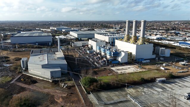 Aerial view of the Rye House Power Station stands stark against the muted winter landscape, its towering chimneys a monument of industry, Hoddesdon, United Kingdom.