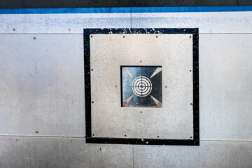 Kitesurfer riding ocean waves creating dramatic water spray. © Trygve