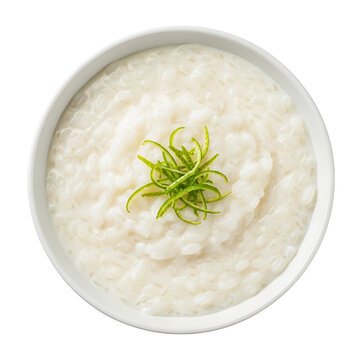 A bowl of creamy rice porridge garnished with green herbs on transparent background