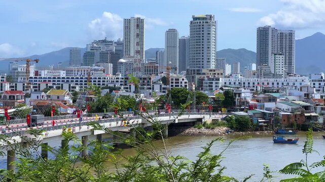 Vietnam, September 7, 2025: View of the Great North Bridge (Tran Phu Bridge), the city, and the Cai River from the Ponagar Temple Complex in sunny weather. View from La-Lao Mountain 4К