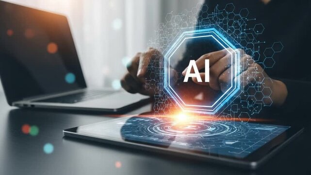 A person interacting with a tablet with an ai logo on the screen next to a laptop on a desk