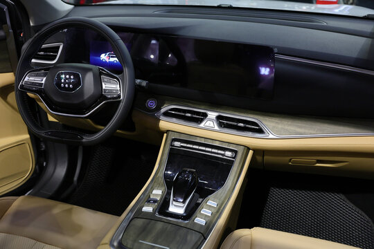 Inside of DSFK E 5 plug-in hybrid (PHEV) mid-size SUV. Photographed in ambiental light. Romania, Bucharest, October 2025.
