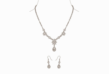 Fototapeta premium Elegant Gold and Diamond Necklace Set with Intricate Floral Design and Matching Dangle Earrings in a Luxurious Jewelry Display against a Soft White Background