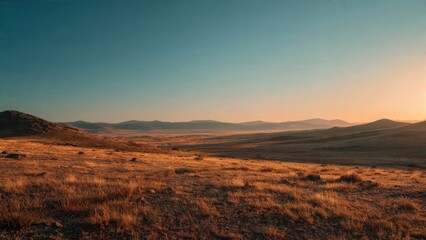 Naklejka premium Golden Hour over rolling hills and dry grassland