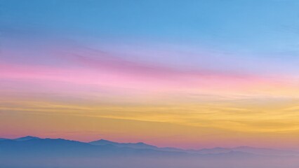 Obraz premium Pastel Sunset Over Mountain Range