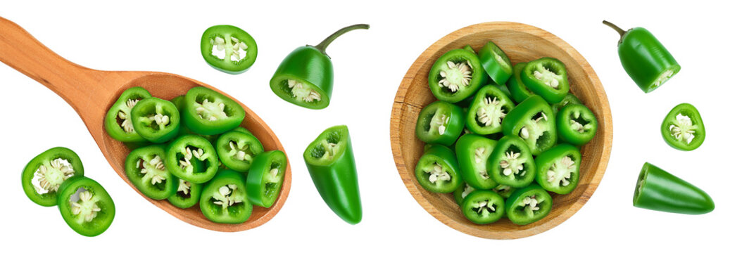 sliced jalapeno pepper in wooden bowl isolated on white background. Green chili pepper . Top view. Flat lay