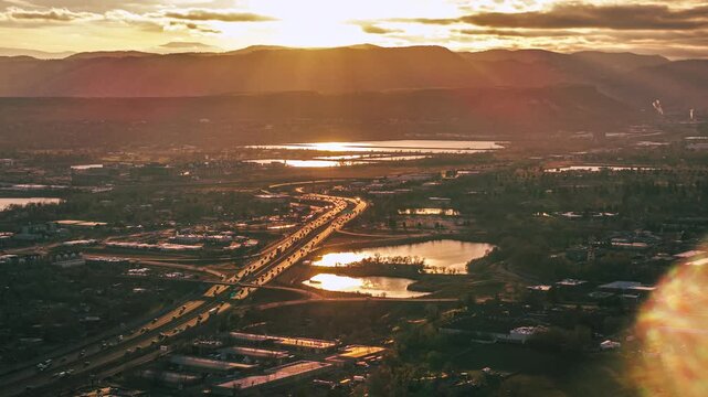 Sunset over highway and mountains, drone hyperlapse, Denver, Colorado 4K