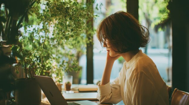 A stylish and natural Japanese woman tapping laptop, angle from the side, her face so it is completely hidden
