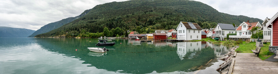 Obraz premium Old boathouses at the harbor of Solvorn village