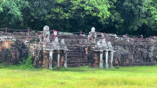 The Elephant Terrace on the Royal Square in the Angkor Thom temple complex in Cambodia. The walls are framed by sculptures of three-headed elephants with trunks shaped like columns. Siem Reap.4K