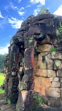 The Elephant Terrace on the Royal Square in the Angkor Thom temple complex in Cambodia. The walls are framed by sculptures of three-headed elephants with trunks shaped like columns. Siem Reap.4K