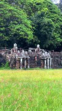 The Elephant Terrace on the Royal Square in the Angkor Thom temple complex in Cambodia. The walls are framed by sculptures of three-headed elephants with trunks shaped like columns. Siem Reap.4K