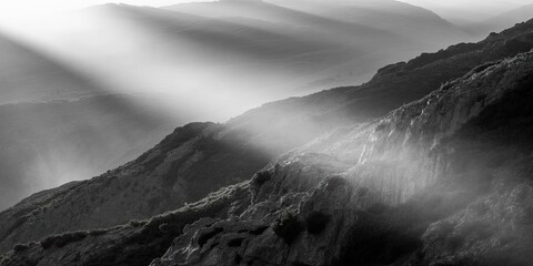 Mountain range enveloped in mist