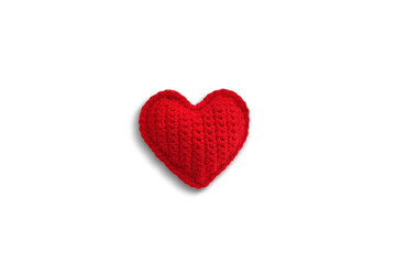 Obraz premium Handmade Red Knitted Heart on white background. Valentines day and love concept.