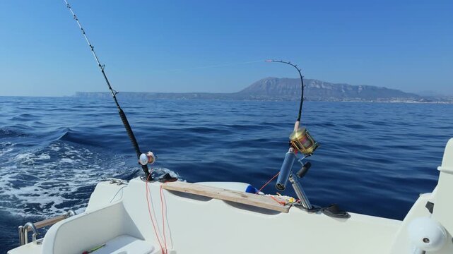 Denia and Javea Costa Blanca trolling fishing rods on boat in Mediterranean Sea