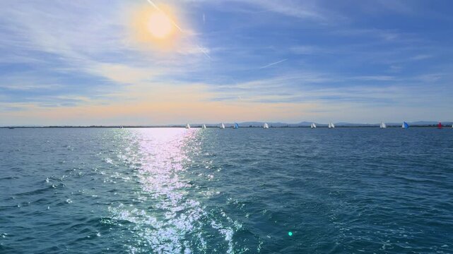 Valencia sailing regatta at sunset with small dinghies on Mediterranean