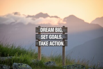 Rustic wooden sign with motivational quote in mountain landscape dream big set goals