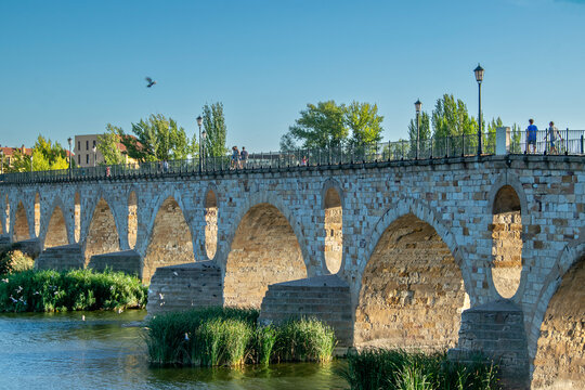 Stone arches of the medieval bridge in zamora city, spain