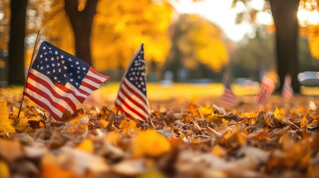 Two American flags gently wave in a park filled with golden autumn leaves, creating a patriotic and serene autumn scene.