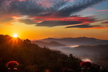 Beautiful sunrise over mountain valley with golden light and mist in Pignone, La Spezia province, Liguria, Italy.
