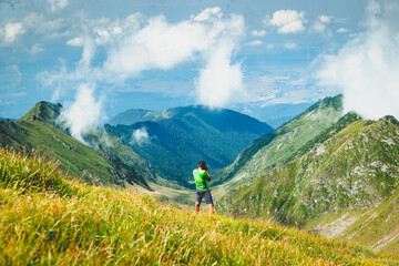 Obraz premium trekking with a dog in hogh mountains