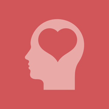 A pink silhouette of a human head with a heart inside, symbolizing love and kindness.