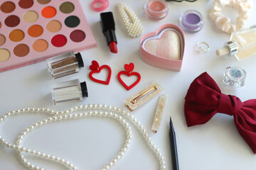 Various accessories and beauty products on white background. Coquette aesthetic. Selective focus.
