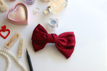 Various accessories and beauty products on white background. Coquette aesthetic. Selective focus.