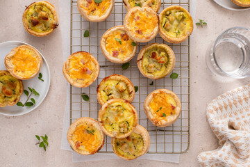 Mini quiches with ham and cheese and chicken and pesto, healthy breakfast or snack idea