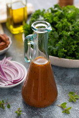 Balsamic vinaigrette salad dressing in a glass bottle
