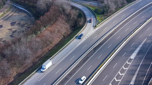 Highway Junction Aerial: An aerial view captures a complex highway interchange, where multiple roads converge and diverge.