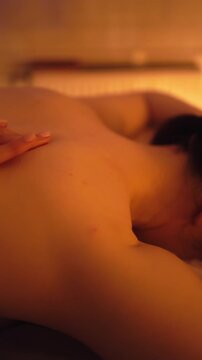 Calm and soothing massage with heated oil aims to diminish shoulder tightness and increase flexibility