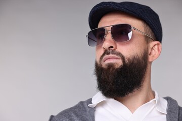 Obraz premium Man with mustache and beard on light grey background. Space for text