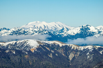 Aerial shot of snowcapped Andes mountain peaks under a clear sky