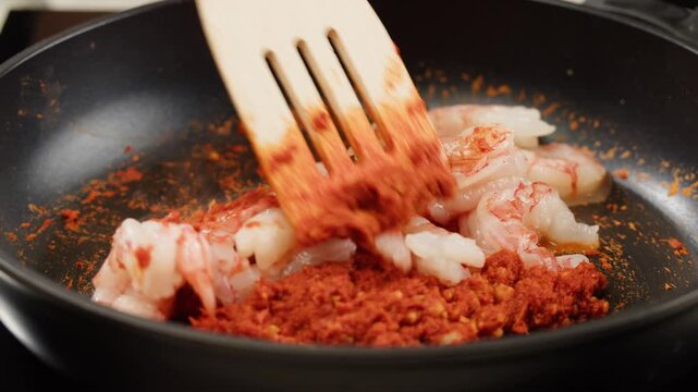 Tamarind red prawn curry cooking, shrimps in tomato ginger sauce, asian kitchen, Chinese restaurant.