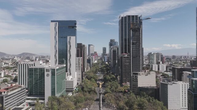 Aerial view over Paseo de la Reforma in Mexico City during the Sunday Ciclot&oacute;n. The drone hovers in front of the Angel of Independence as cyclists take over the iconic avenue