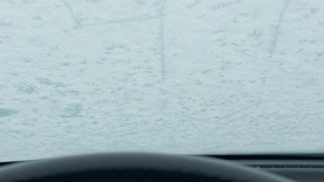 Blizzard obscures driving visibility, Heavy snow blocks sightlines and muffles surroundings