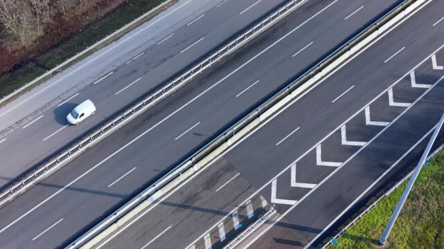 A Highway Journey: An aerial perspective captures a highway, where a lone van navigates the open road and the freedom of the road.