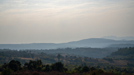Obraz premium Valley is surrounded by mountains adding to the sense of serenity.