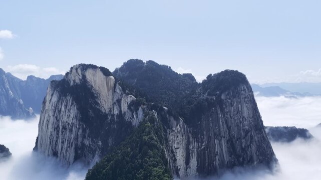 Aerial retreat video of majestic peaks rising above a vast sea of clouds, Mount Huashan, Shaanxi province, China