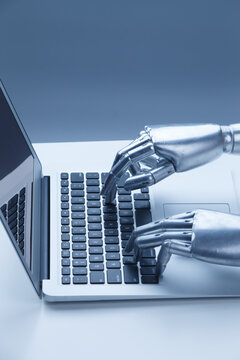 Robot Hands Typing on Laptop Keyboard - AI Technology