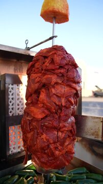 Slow Motion Mexican Al Pastor Meat Sizzling on a Trompo Grill