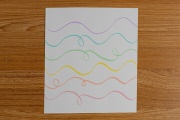 Minimal Colorful Wavy Line Drawing on White Paper Background