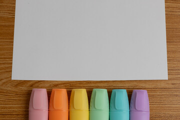 Blank White Paper with Pastel Highlighters and Copy Space