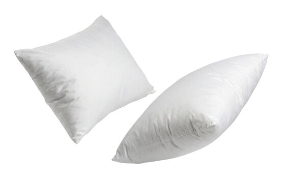 two plump white throw pillows with a subtle geometric pattern, one angled and the other lying flat, isolated on a transparent background.