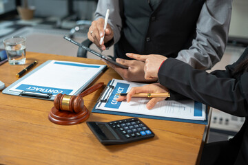 Teamwork of business lawyer meeting working hard about legal legislation in courtroom to help their customer.